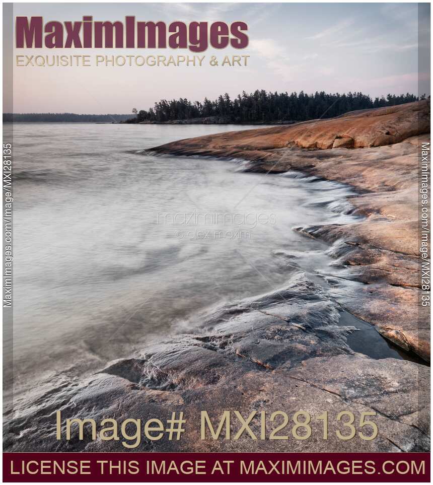 Red rocks on shore of Georgian Bay at dawn