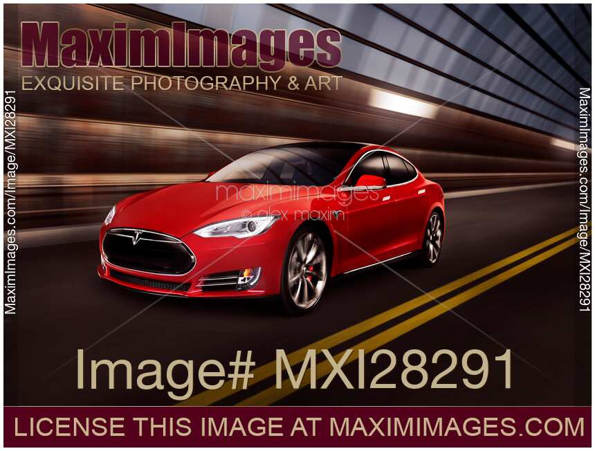 Red Tesla Model S red luxury electric car speeding in a tunnel