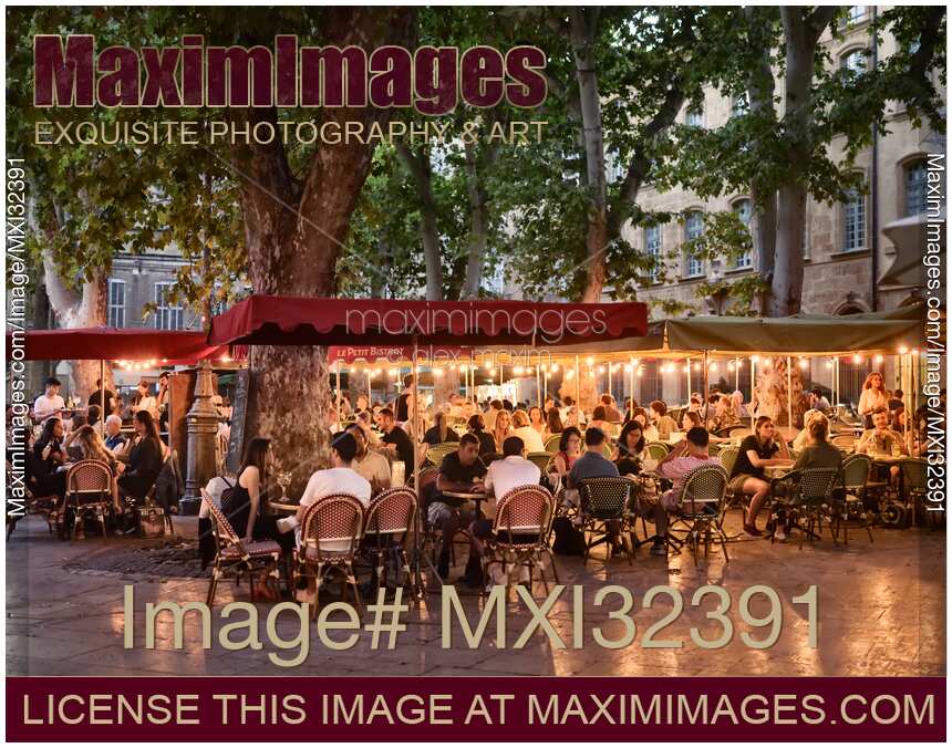 Restaurant terrace busy with people in Aix-en-Provence South France in the evening