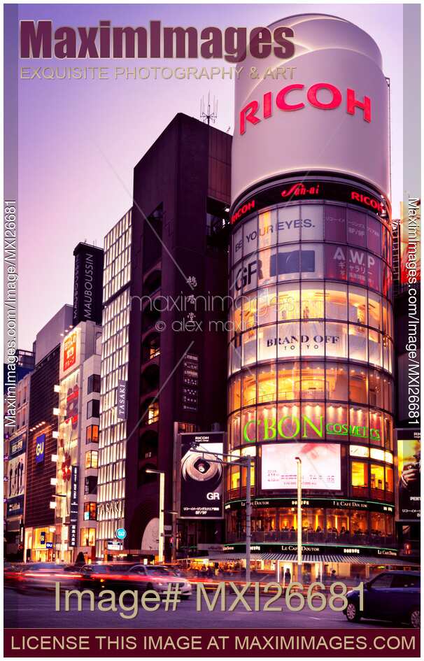 Ricoh building and colorful signs at twilight in Tokyo