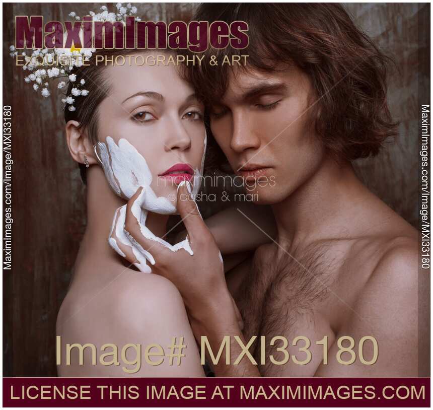 Romantic couple, an artist and a model got carried away with painting, sensual portrait