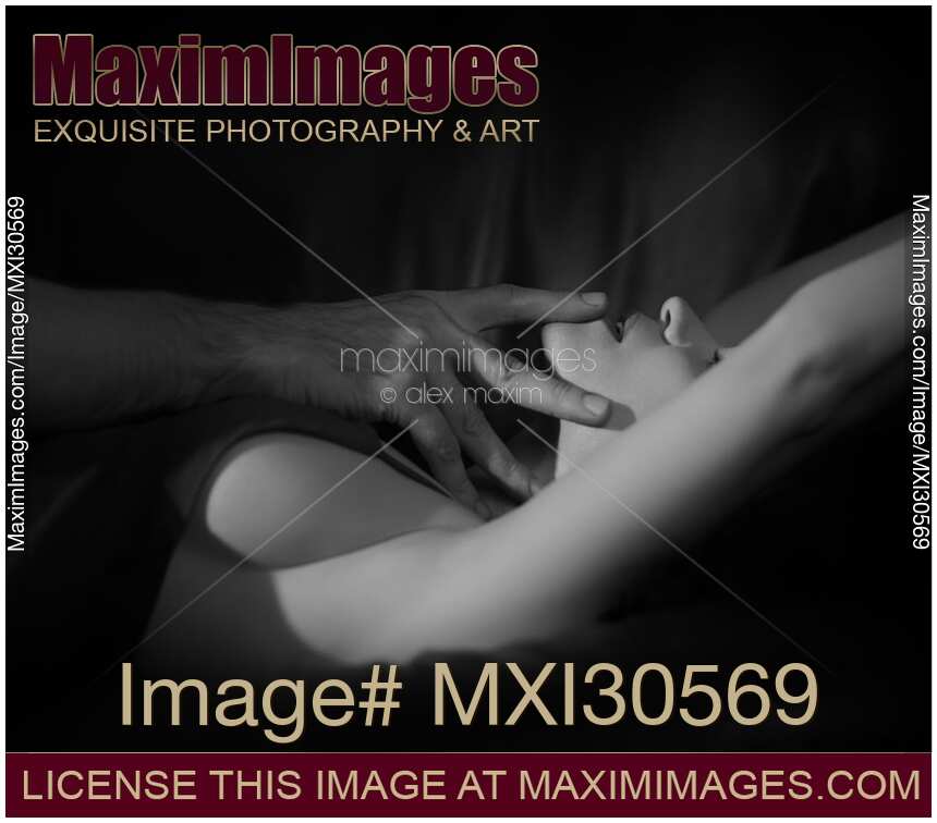 Romantic couple black and white closeup of man's hand touching woman sensual open lips