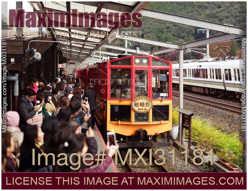 Sagano Scenic Railway Romantic train at Kameoka torokko station platform full of tourists