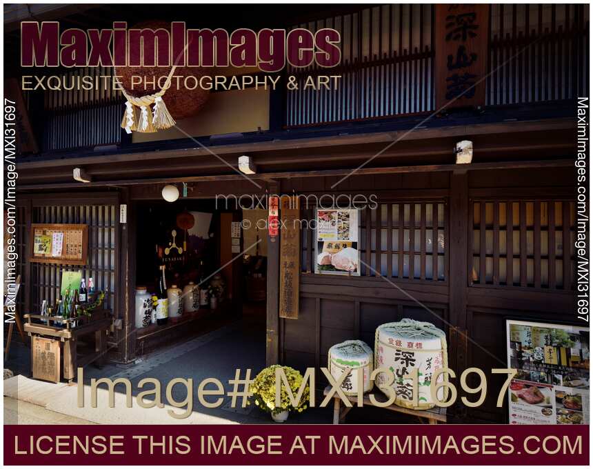 Sake brewery entrance at Kamisannomachi old town of Takayama with Sugidama cedar sake ball hanging above