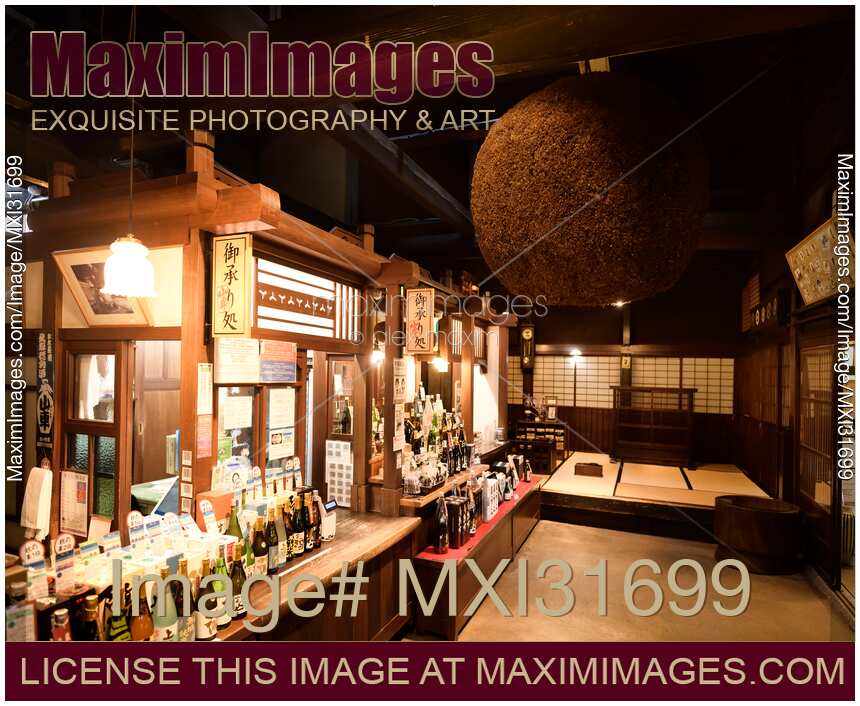 Sake brewery shop interior with Sugidama cedar ball hanging inside Takayama Japan