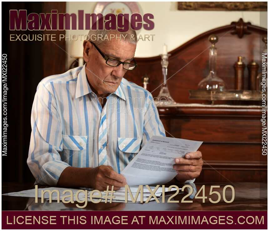 Senior Looking Through Bills