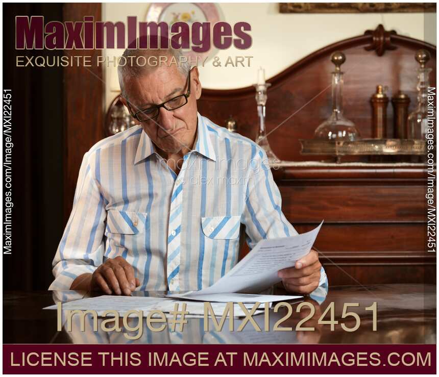 Senior Looking Through Bills