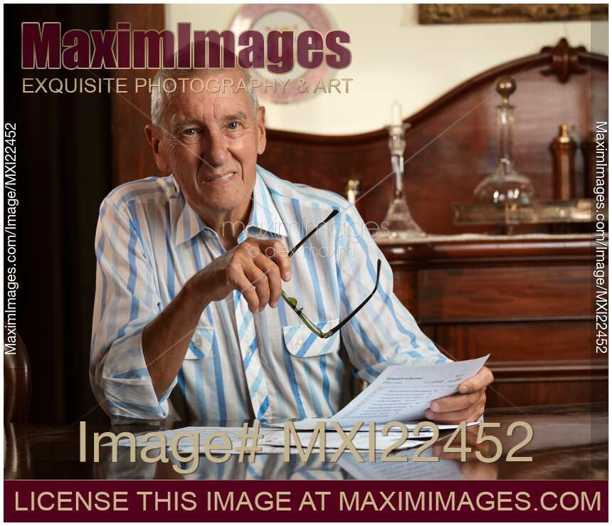 Senior Looking Through Bills