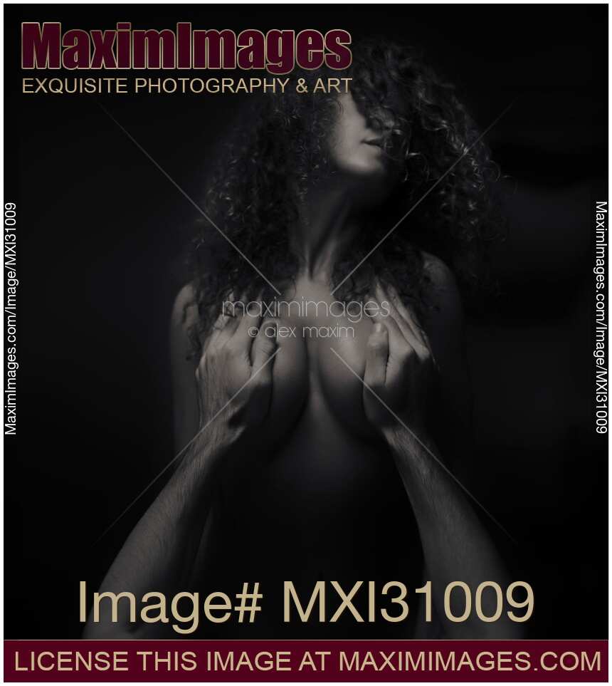 Sensual art nude black and white portrait of couple making love Man hands covering beautiful woman chest Tantric sexuality