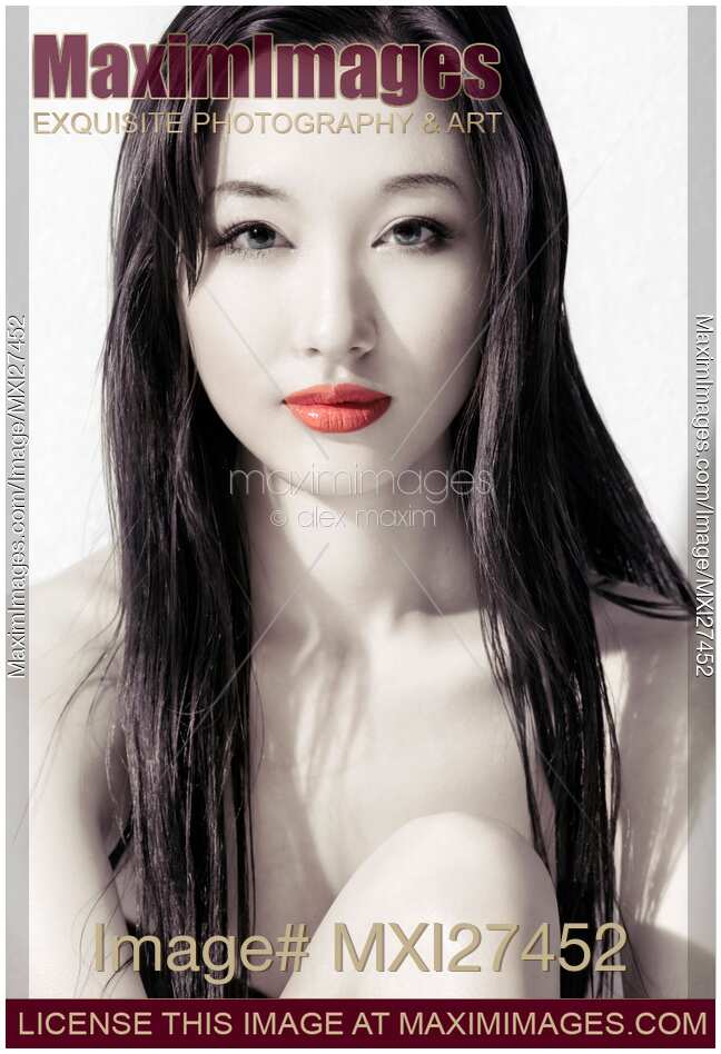 Sensual artistic beauty portrait of young asian woman face