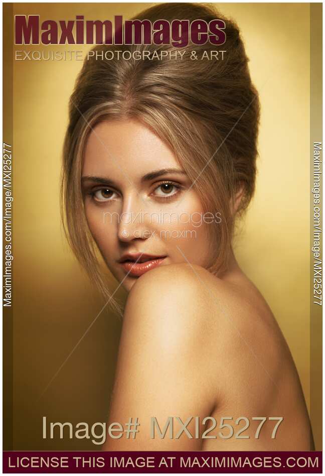 Sensual beauty portrait of woman in golden colors
