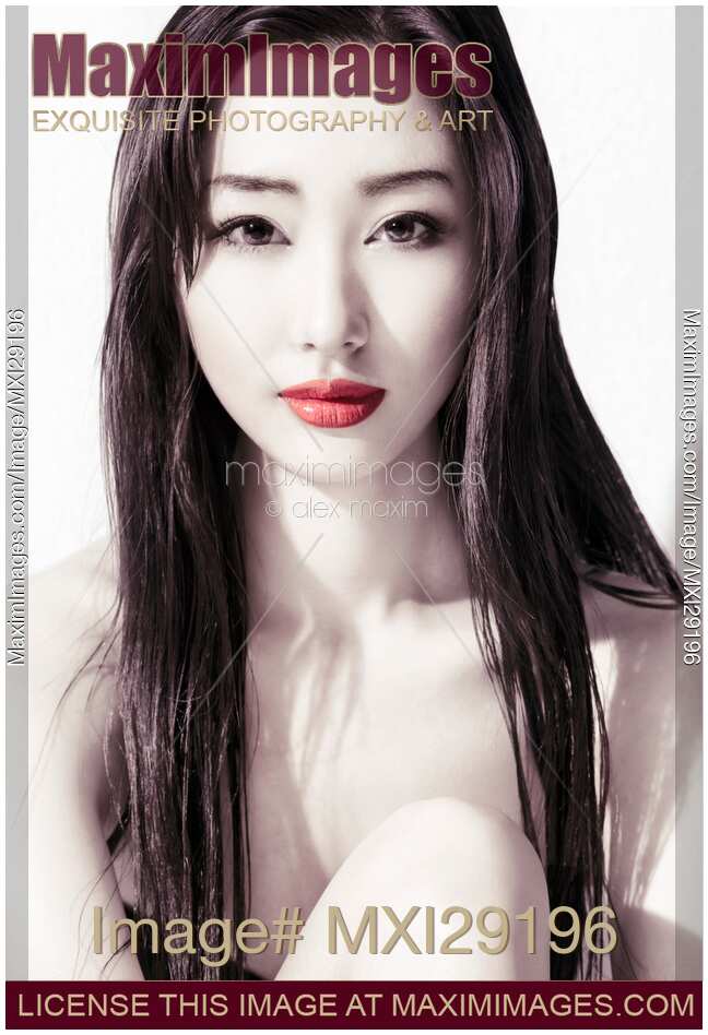 Sensual beauty portrait of young asian woman face with red lips