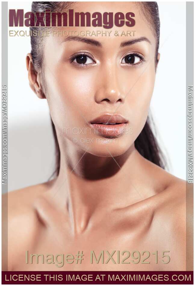 Sensual closeup beauty portrait of a young woman exotic face