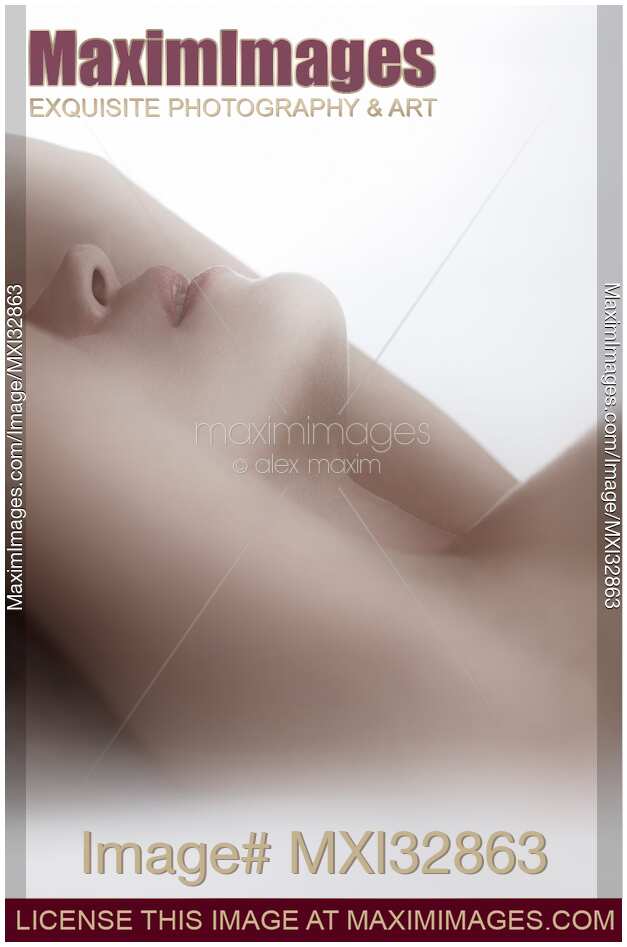 Sensual closeup of nude woman neck and lips in soft white light Making love Artistic concept