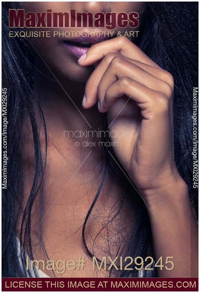 Sensual closeup of woman mouth biting her finger