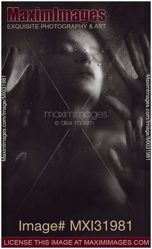 Sensual couple making love behind wet shower glass black and white