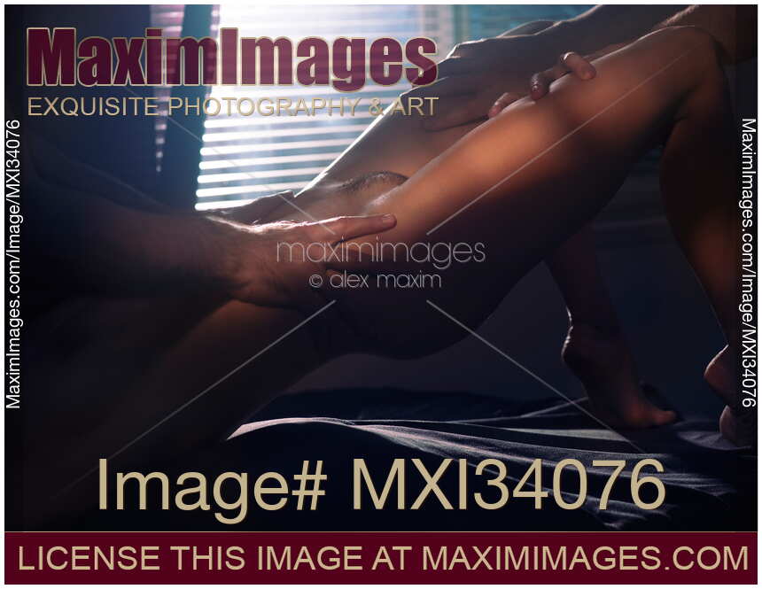 Sensual erotic threesome closeup of beautiful naked woman body and hands of two men caressing her