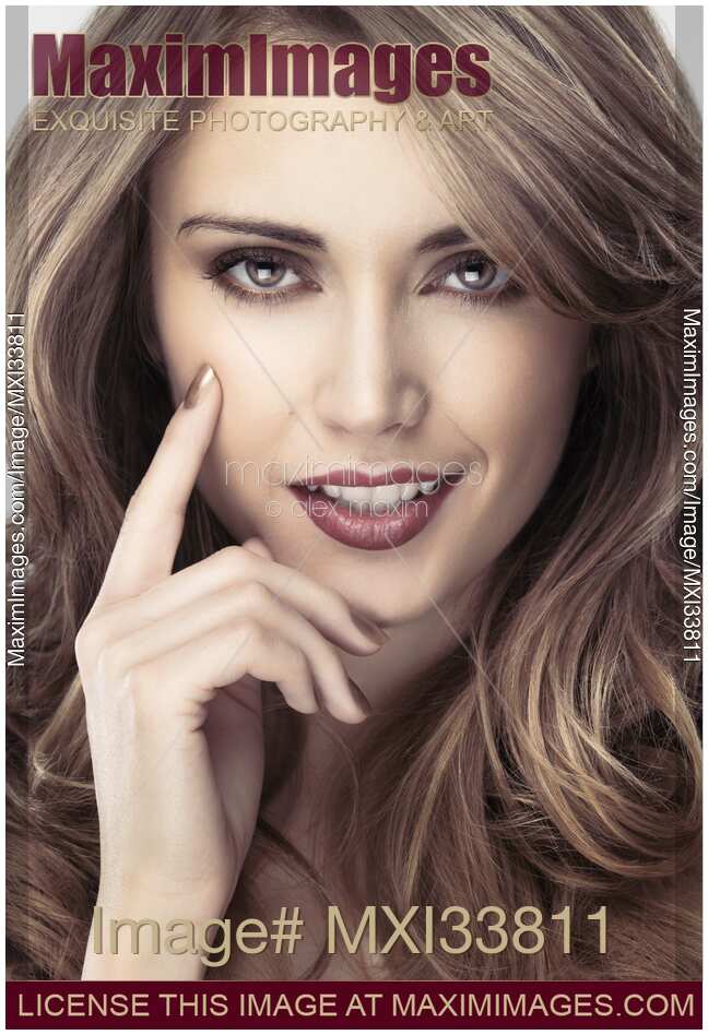 Sensual face portrait of woman with expressive gray eyes and glamorous light brown hair