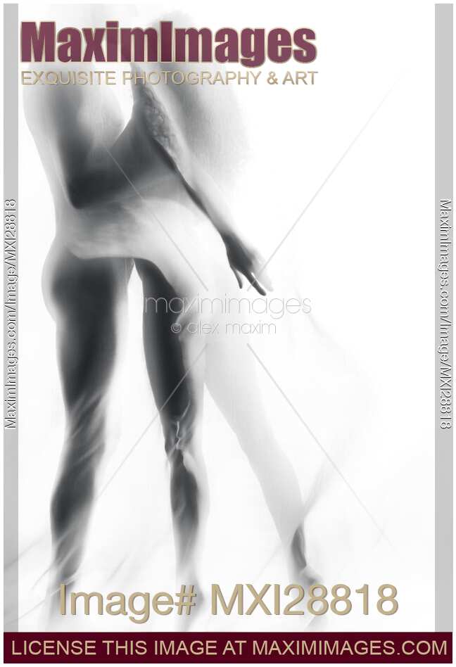 Sensual nude couple kissing in white mist of a veil