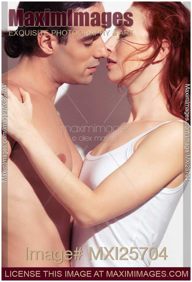 Sensual portrait of beautiful young couple kissing