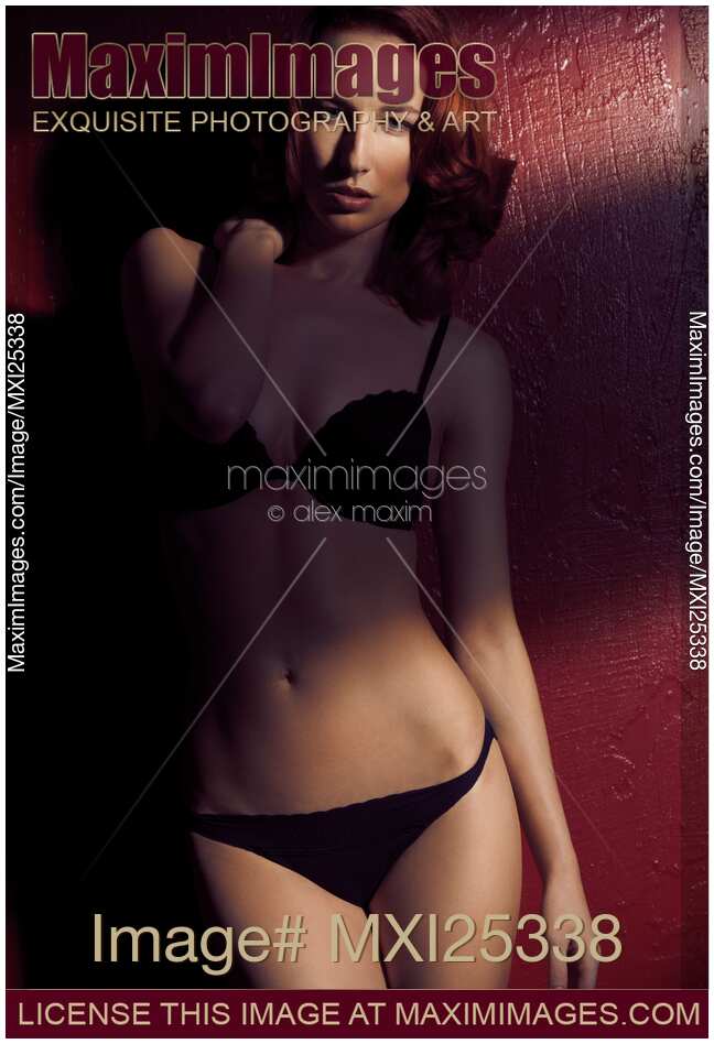 Sensual portrait of sexy red haired woman wearing lingerie