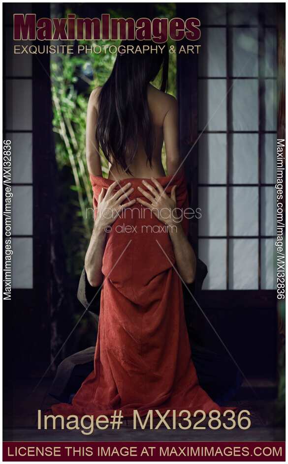 Sensual romantic Asian couple in traditional clothes making love in Japanese historic house settings