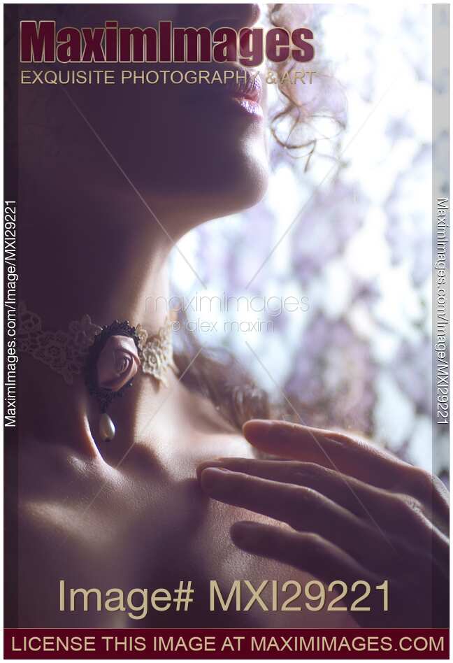 Sensual woman face with a rose choker on her neck