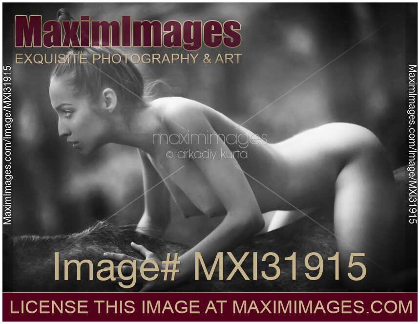 Sexy black and white fine art nude image of a young woman horseback riding