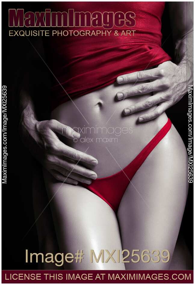 Sexy couple Man hands embracing woman in red