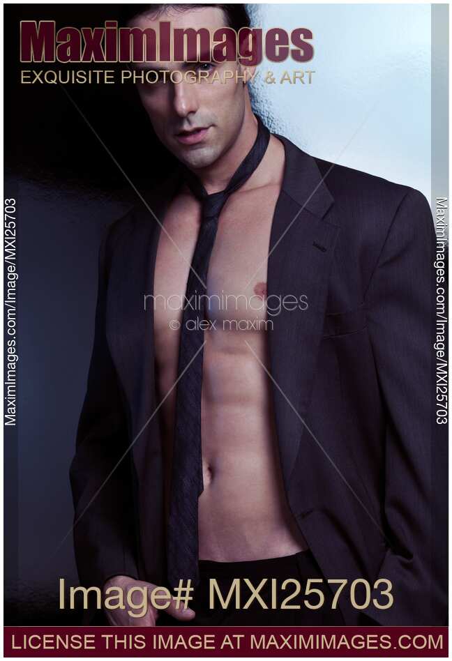 Sexy handsome man wearing jacket and tie