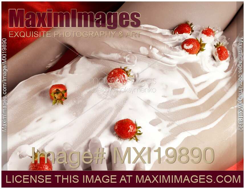 Sexy Naked Woman Body Covered with Cream and Strawberries