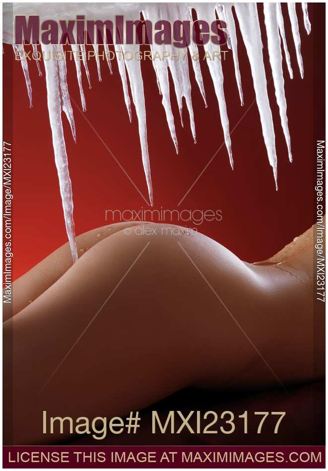 Sexy Naked Woman Under Melting Icicles