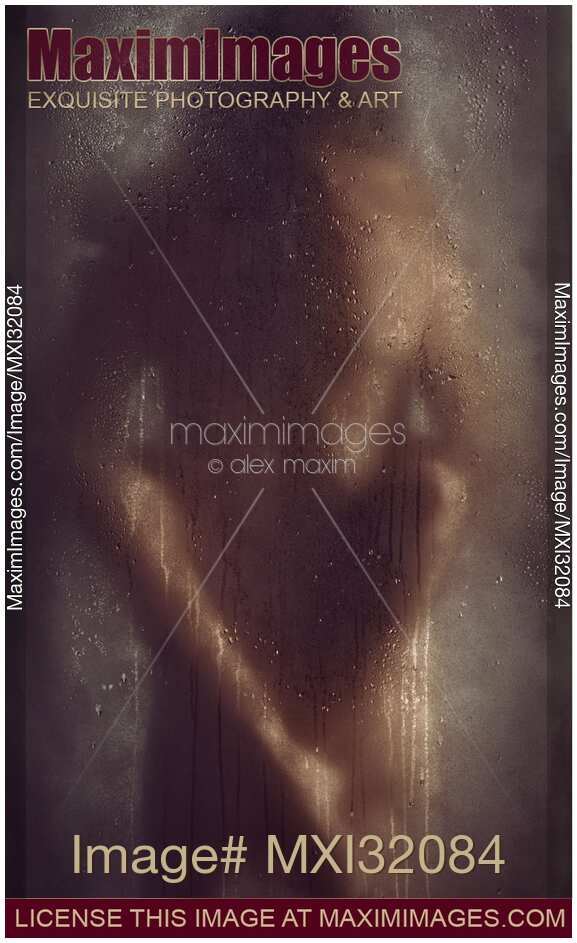 Sexy nude couple making love behind wet shower glass Rear view of man back with woman legs crossed behind
