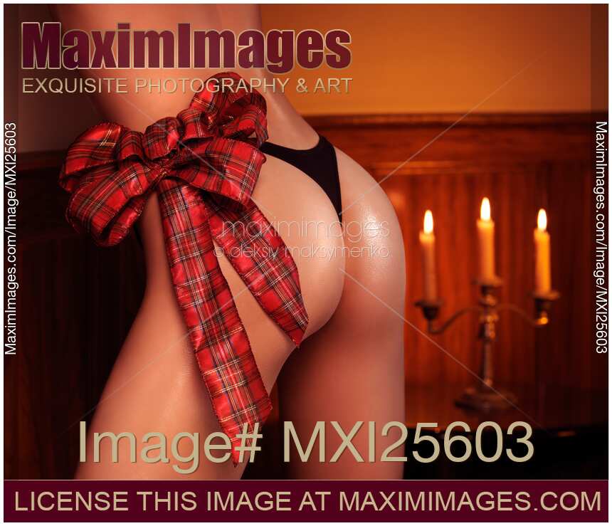 Sexy woman butt with a Christmas bow