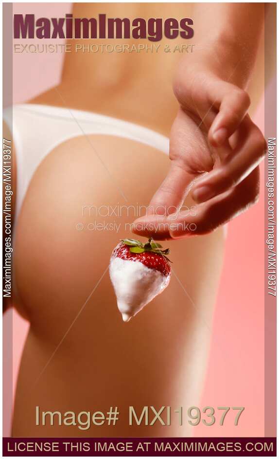 Sexy Woman Teasing with a Strawberry