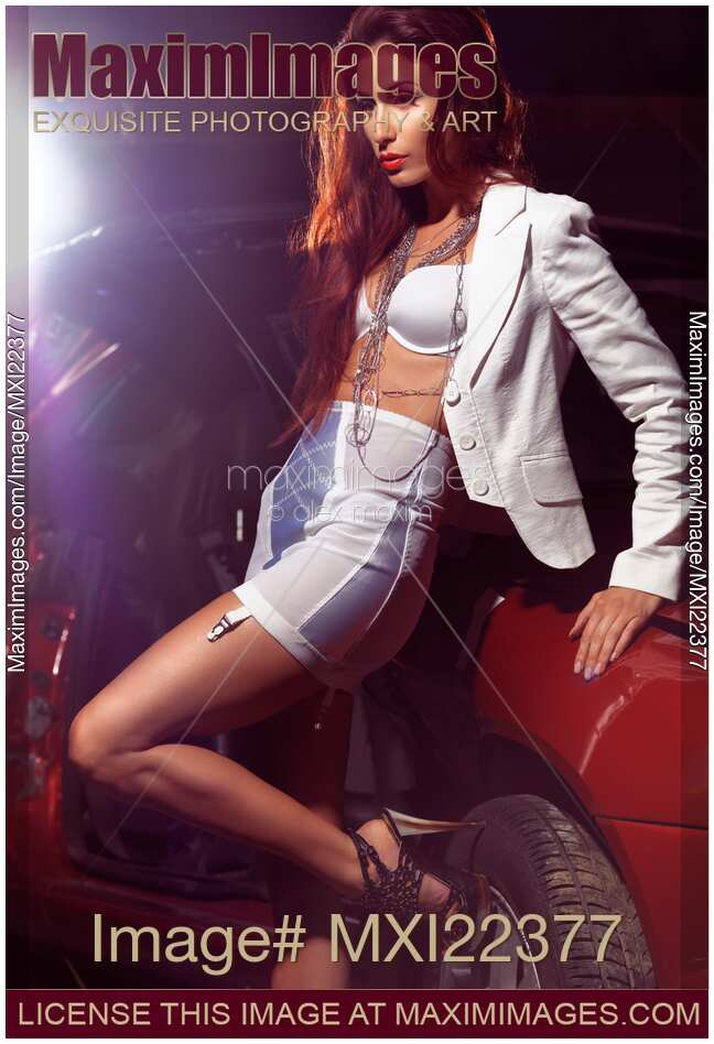 Sexy Young Woman With Wrecked Car