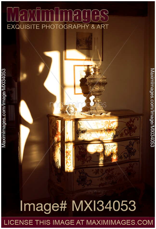 Shadow of a sensual nude woman body silhouette in window sunlight on a wall of an antique house