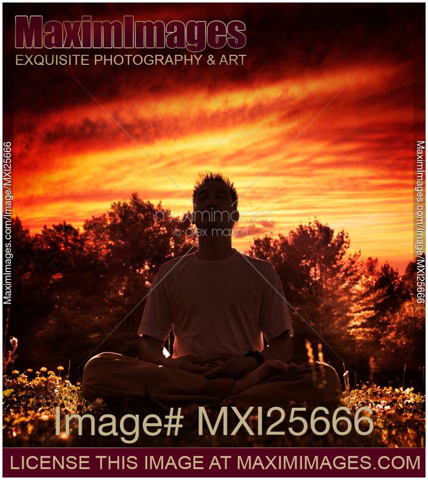Shaolin Kung Fu instructor meditating in the nature during sunset
