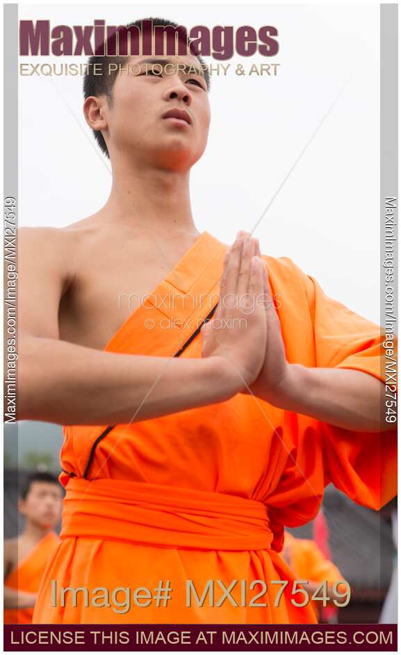 Shaolin Kung Fu student with folded hands in China