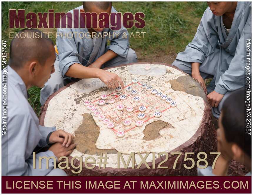 Shaolin martial arts school students playing Xiangqi Chinese chess