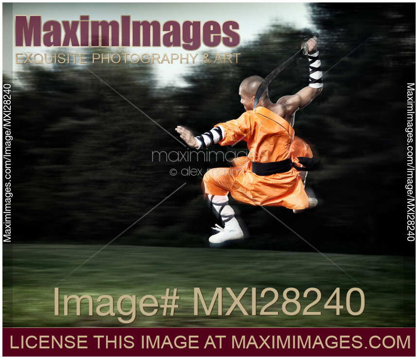 Shaolin warrior monk martial artist in mid-air with a sword