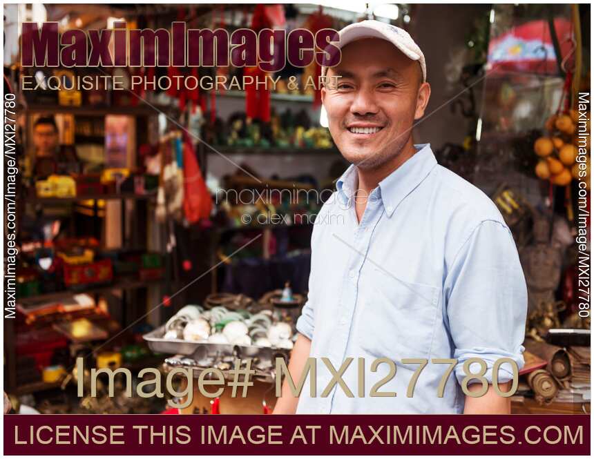 Shop owner at antique market in Shanghai, China