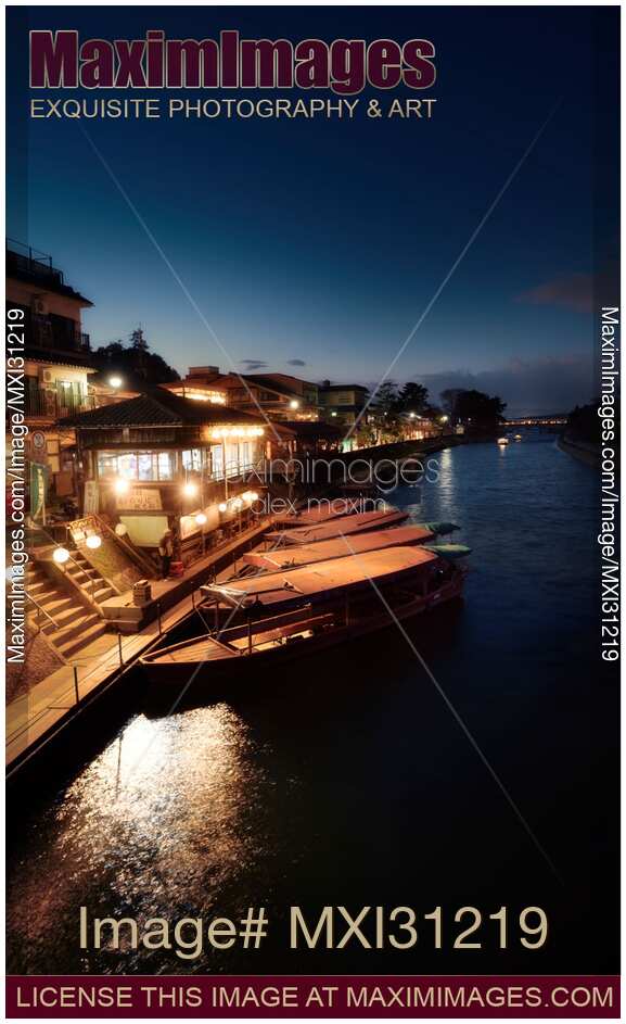 Sightseeing pleasure cruise boats at night on Uji River in Japan