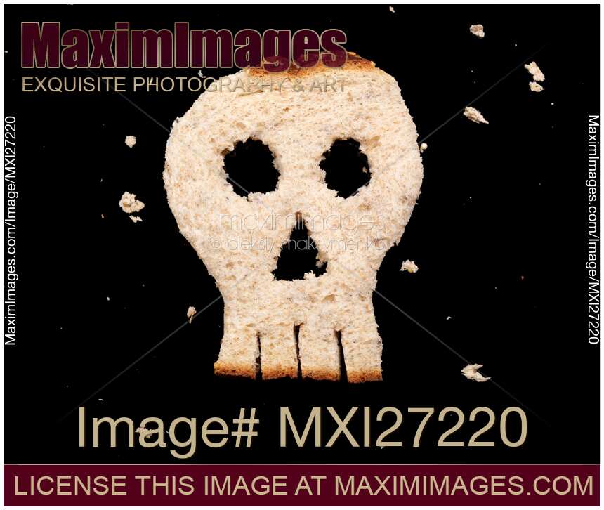 Skull made of bread on black