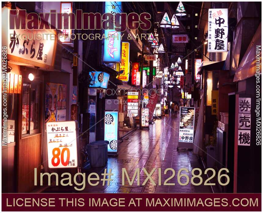 Small city street with restaurants in Japan at night