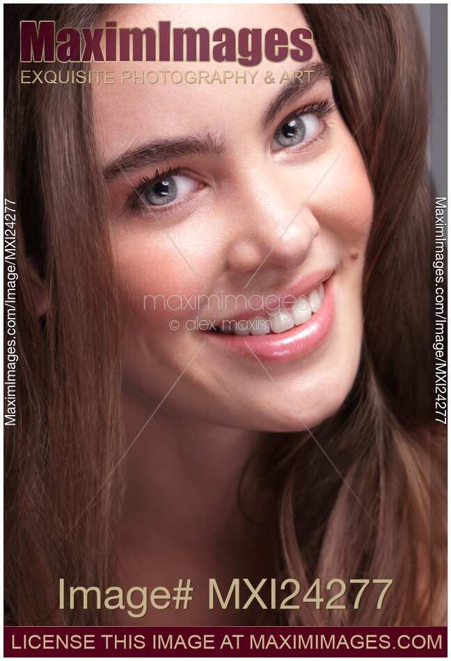 Smiling young woman closeup of face