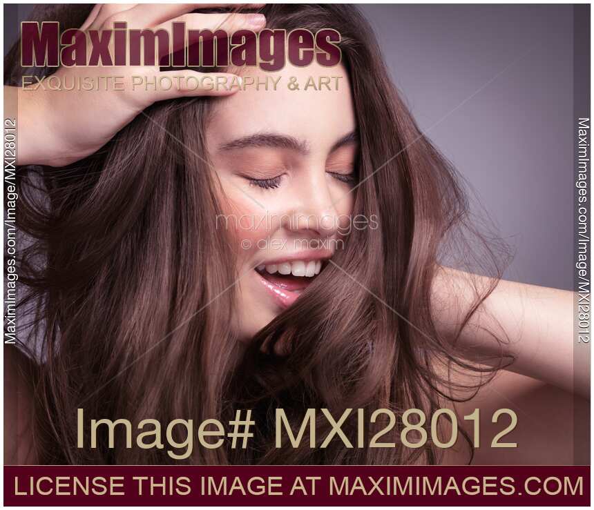 Smiling young woman with long brown hair