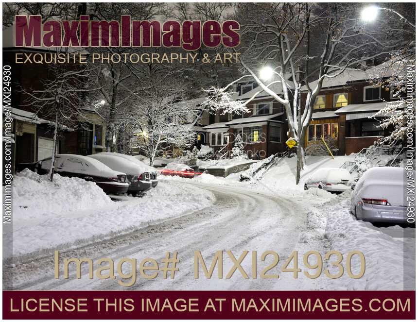 Snow covered street at night