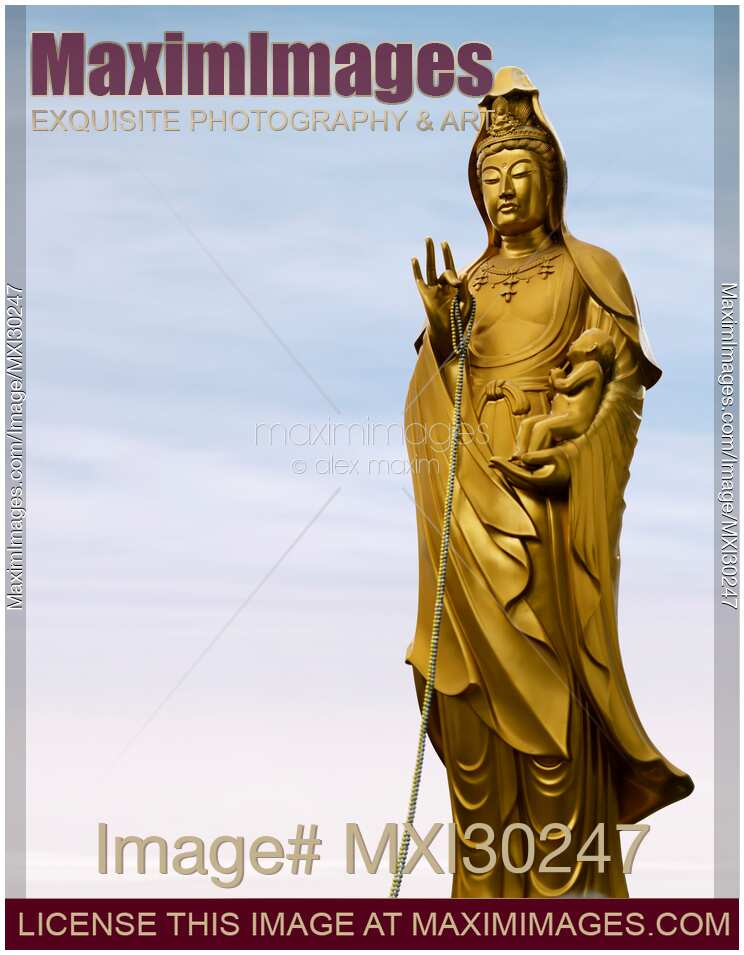 Statues of female Buddha Guanyin the Goddess of Compassion with a baby in her hands