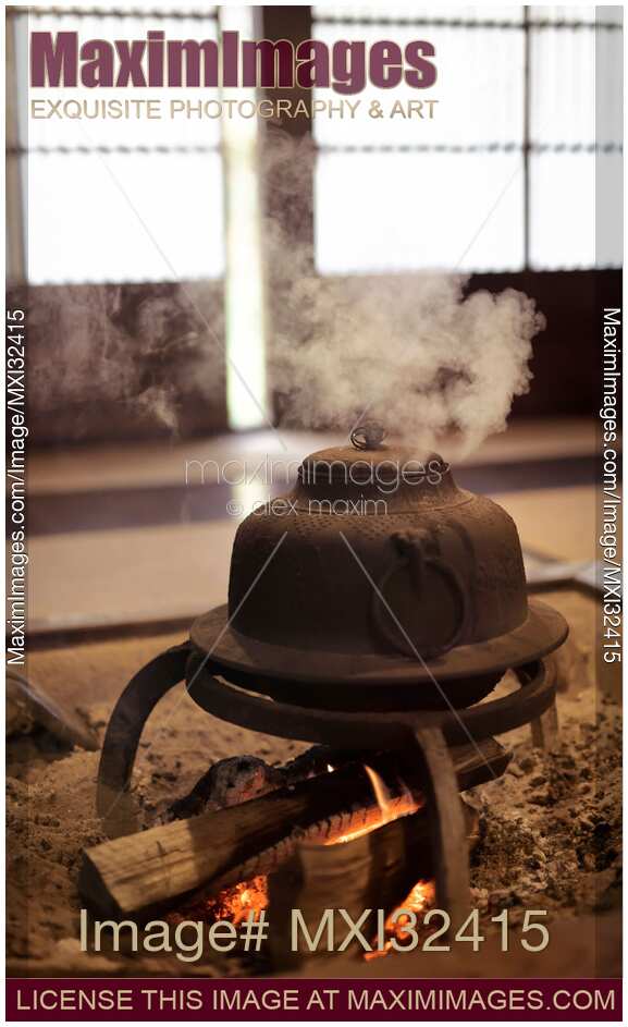 Steaming iron kettle Kama on firewood in a traditional Japanese house